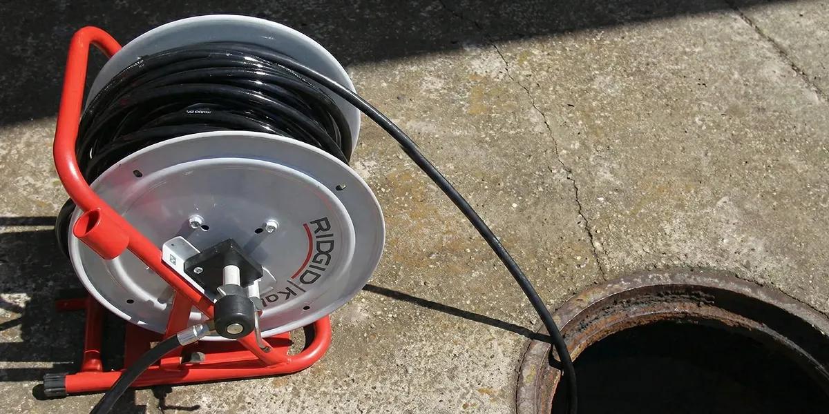 sewer rodding equipment prepared to clear clogged sewer lines in Peoria, IL